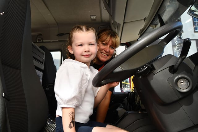 Nara McCormick, four, from Camelon in fire engine with community firefighter Elaine Dowie