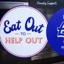 A sign promoting the Eat Out to Help Out scheme.