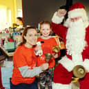 Seven-year-old Aria Wotherspoon and mum Sarah meet Santa Claus at the event in the Maggie's Centre in Larbert.