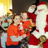 Seven-year-old Aria Wotherspoon and mum Sarah meet Santa Claus at the event in the Maggie's Centre in Larbert.