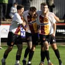 Grant Hamilton is mobbed by his Whitburn team-mates after scoring a late winner against Camelon Juniors on Saturday in the East of Scotland first division (Pictures by Kristopher Dowell)