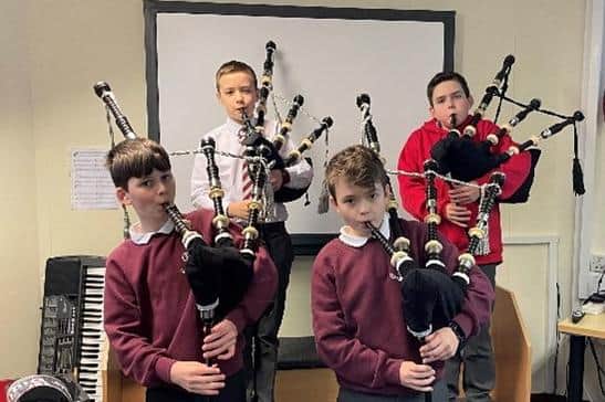 The Comely Park Primary School pupils get to grips with their new bagpipes
