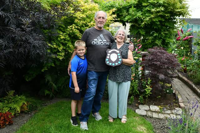 Drummond and June Penn with seven-year-old grandson Winters Dunn who helps them in their garden. Pic: Michael Gillen