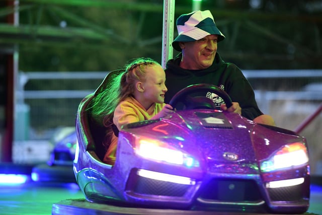 Having fun on the fairground rides.