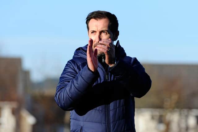 Head coach Martin Rennie applauds the travelling support (Pictures: Alan Murray)