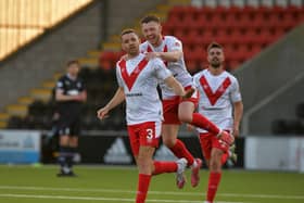 Ex-Falkirk ace Aaron Taylor-Sinclair gestures to the travelling support after heading home Airdrie's fourth goal (Photo: Michael Gillen)