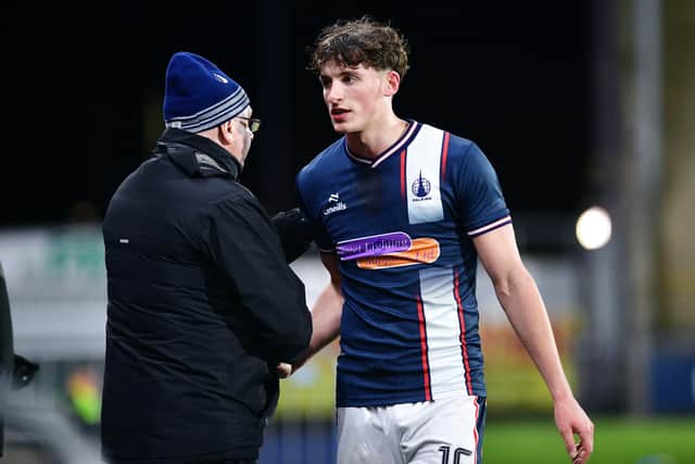 Barney Stewart and his boss John McGlynn embrace on the touchline after a Stirlingshire Cup tie (Photo: Michael Gillen)