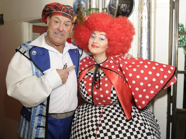 Andy Gray as Buttons and his daughter Clare as a Wicked Sister meet backstage during Cinderella at the King's
