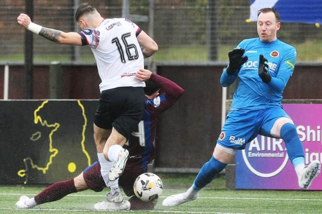 Callum Sandilands shoots past Darren Jamieson for 3-0