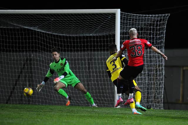 Callumn Morrison shoots home Falkirk's opener at Dumbarton (Pic by Michael Gillen)