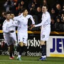 Jaze Kabia celebrates with team-mates after opening scoring during 3-0 win in Alloa in February (Pic Michael Gillen)