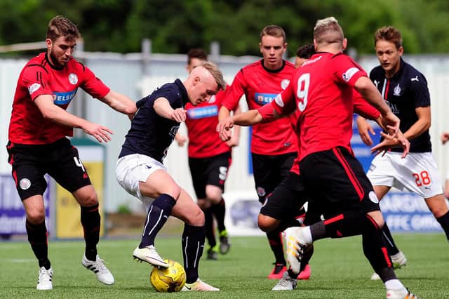 Darren McCormack (1st left) is pictured playing for Brechin City against Falkirk in July 2016 (Pic by Michael Gillen)