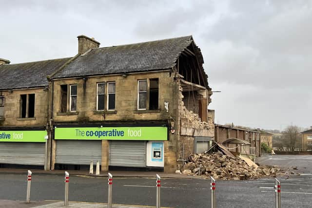 The gable end of the Denny Co-op building collapsed in the strong winds with the area currently closed off. Pic: Michael Gillen