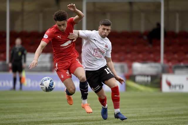 Coventry City loanee Blaine Rowe battles for possession the ball in midfield up against Clyde's Liam Scullion