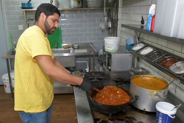 Ammar Ali, owner of Indian Cottage in Bonnybridge, wanted to do his bit to support struggling families by handing over free curries to ROOTS Helping Hands Food Share. Picture: Michael Gillen.