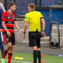 Max Christie, right, gesticulates angrily at Kieran Gibbons after the player’s late foul on Danny Galbraith (Pic by Michael Gillen)