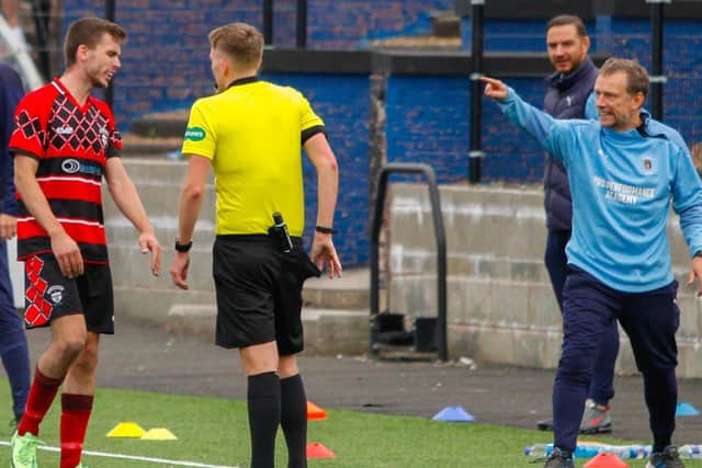 Max Christie, right, gesticulates angrily at Kieran Gibbons after the player’s late foul on Danny Galbraith (Pic by Michael Gillen)