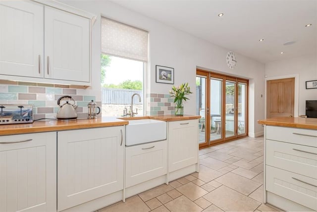 The kitchen and family area features large bi-fold doors to the rear garden.