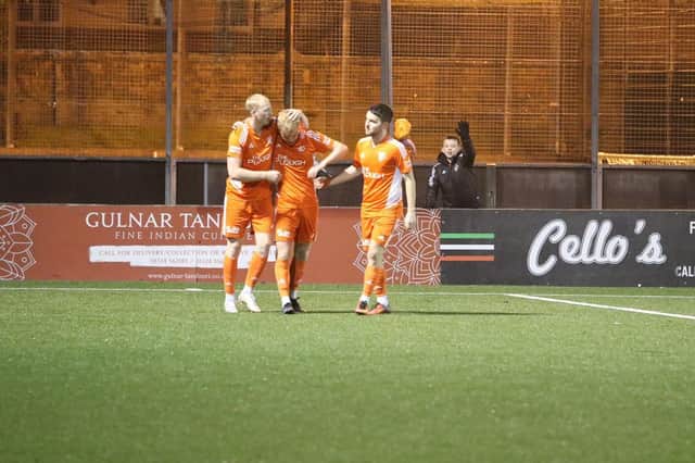 Callum Sheridan is congratulated by his team-mates after scoring for Syngenta (Photo: Alan Upton)