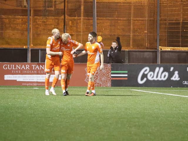 Callum Sheridan is congratulated by his team-mates after scoring for Syngenta (Photo: Alan Upton)