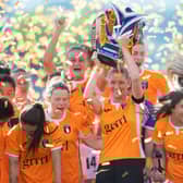 Leanne Ross  lifts the SWPL trophy as Glasgow City secured an incredible 14th consecutive title (Photo by Mark Scates / SNS Group)