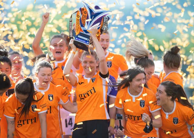 Leanne Ross  lifts the SWPL trophy as Glasgow City secured an incredible 14th consecutive title (Photo by Mark Scates / SNS Group)