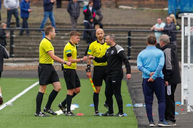 East Stirlingshire boss Derek Ure with officials at full-time after Saturday's 3-3 draw against Bo'ness (Pic by Michael Gillen)
