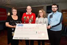 Thomas Horn handing over a cheque for £6000 to Plus Forth Valley CEO Susan Fullarton. Pic: Michael Gillen