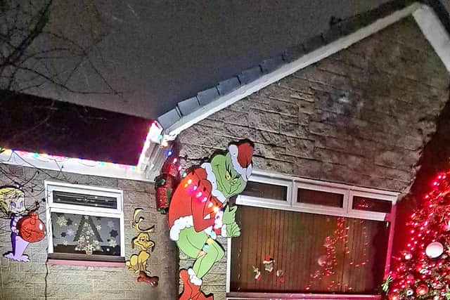 The Grinch display has drawn attention from motorists
