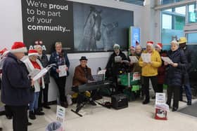 Carols were being sung in Grangemouth's Asda store on Saturday by members of local churches.  (Pic: Scott Louden)