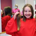 Eva Morrison (9) gets her hair cut for the Little Princess Trust after being inspired by her dad's cancer diagnosis