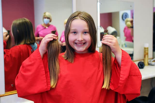 Eva Morrison (9) gets her hair cut for the Little Princess Trust after being inspired by her dad's cancer diagnosis