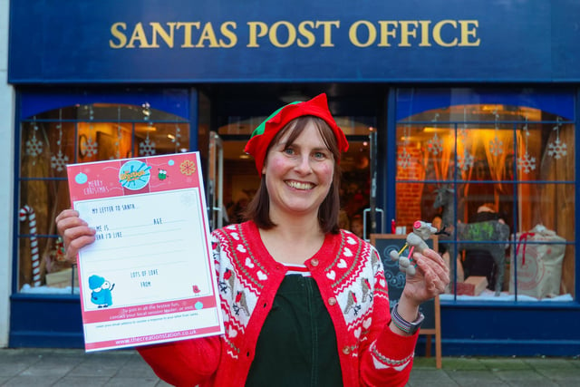 Lisa from Creation Station Falkirk outside Santa's Post Office Christmas activity centre which opened in the High Street on Saturday.