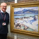 Gavin Grant at the Collections Centre, standing beside his favourite painting in the Fife Collection, Samuel Peploe’s Ben More from Iona.   (Pic: OnFife)