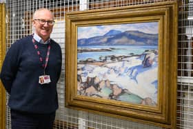 Gavin Grant at the Collections Centre, standing beside his favourite painting in the Fife Collection, Samuel Peploe’s Ben More from Iona.   (Pic: OnFife)