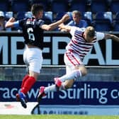 The unfortunate moment that turned the game - Gary Miller of Falkirk is about to be dismissed for a pull on Accies sub Andy Ryan, which led to Ronan Hughes converting a penalty kick (picture by Michael Gillen).