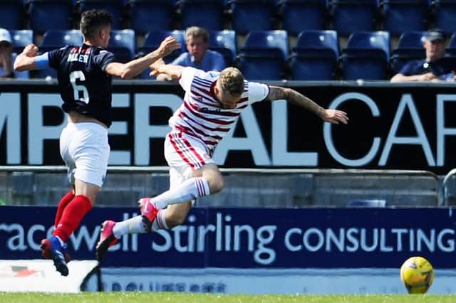 The unfortunate moment that turned the game - Gary Miller of Falkirk is about to be dismissed for a pull on Accies sub Andy Ryan, which led to Ronan Hughes converting a penalty kick (picture by Michael Gillen).