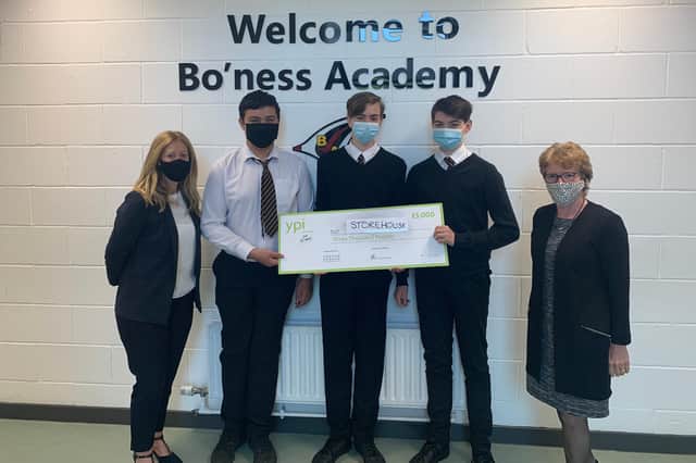 Bo'ness Academy pupils Callum Bloomfield, Tayler Adamson and Jamie Demirkoc, who represented Bo’ness Storehouse, received the donation for the local cause.