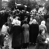 The young lady with the baby on the left is the wife of John Miller and mother of Dorothy Crawford.  Waiting with the crowds for news following the Redding Pit Disaster.