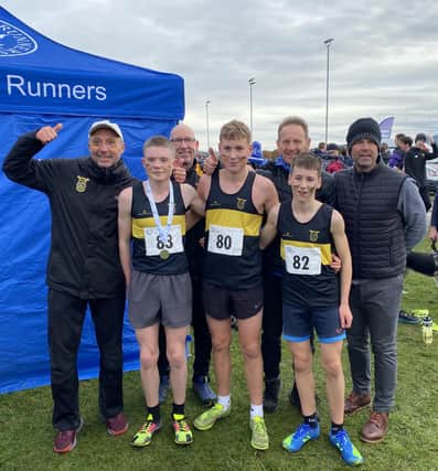 Falkirk Vics’ coaches alongside under-15 silver winning trio Ray Taylor, Hamish Hunter and Luke Sedman