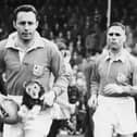 MYSTERY PLAYER: Who is this former Ireland and Lions captain, seen left with mascot (Photo: Getty Images)
