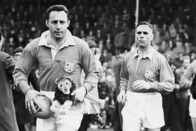 MYSTERY PLAYER: Who is this former Ireland and Lions captain, seen left with mascot (Photo: Getty Images)