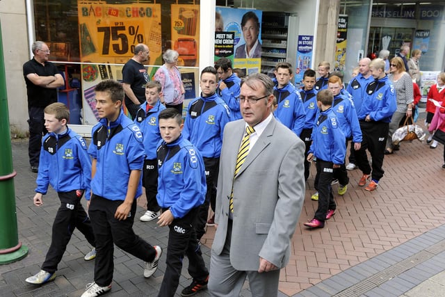 The young footballers reach La Porte Precinct.