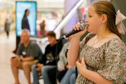 Rachel Ronnie sings her heart out in the Buchanan Galleries at the launch on the new Busk Stop (Picture: Submitted)