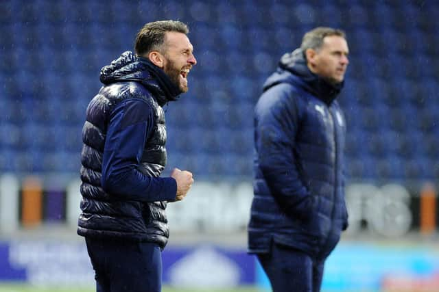 Co-managers Lee Miller and David McCracken celebrate the goal