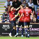 Ross MacIver is mobbed by his Falkirk team-mates after scoring the Bairns' opener against Dunfermline Athletic on Saturday at East End Park (Photo: Michael Gillen)