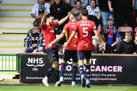 Ross MacIver is mobbed by his Falkirk team-mates after scoring the Bairns' opener against Dunfermline Athletic on Saturday at East End Park (Photo: Michael Gillen)