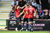Ross MacIver is mobbed by his Falkirk team-mates after scoring the Bairns' opener against Dunfermline Athletic on Saturday at East End Park (Photo: Michael Gillen)