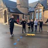 Low Port Primary pupils Rory Paton, Johnny Waddell, Oliver Dodd, Harry McGrory and Adam Clark with Rose gaffer Gordon Herd and Fanbase Director Mikey Crawley (with niece Eva, right)