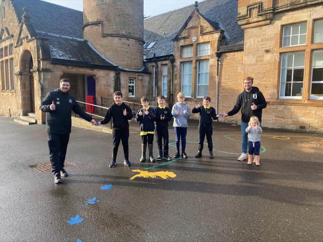 Low Port Primary pupils Rory Paton, Johnny Waddell, Oliver Dodd, Harry McGrory and Adam Clark with Rose gaffer Gordon Herd and Fanbase Director Mikey Crawley (with niece Eva, right)